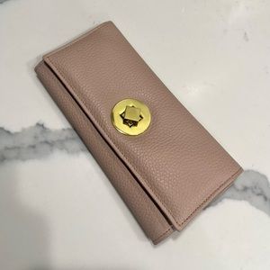 NWOT. Blush colored, long wallet.